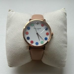 Kate Spade women’s watch with multicolor face and light pink leather strap